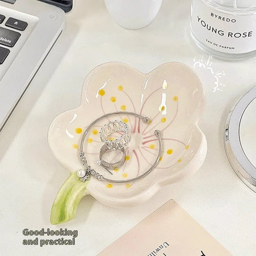 White porcelain storage tray with optional small night light, shown in pink and white shell colours on a wooden surface.