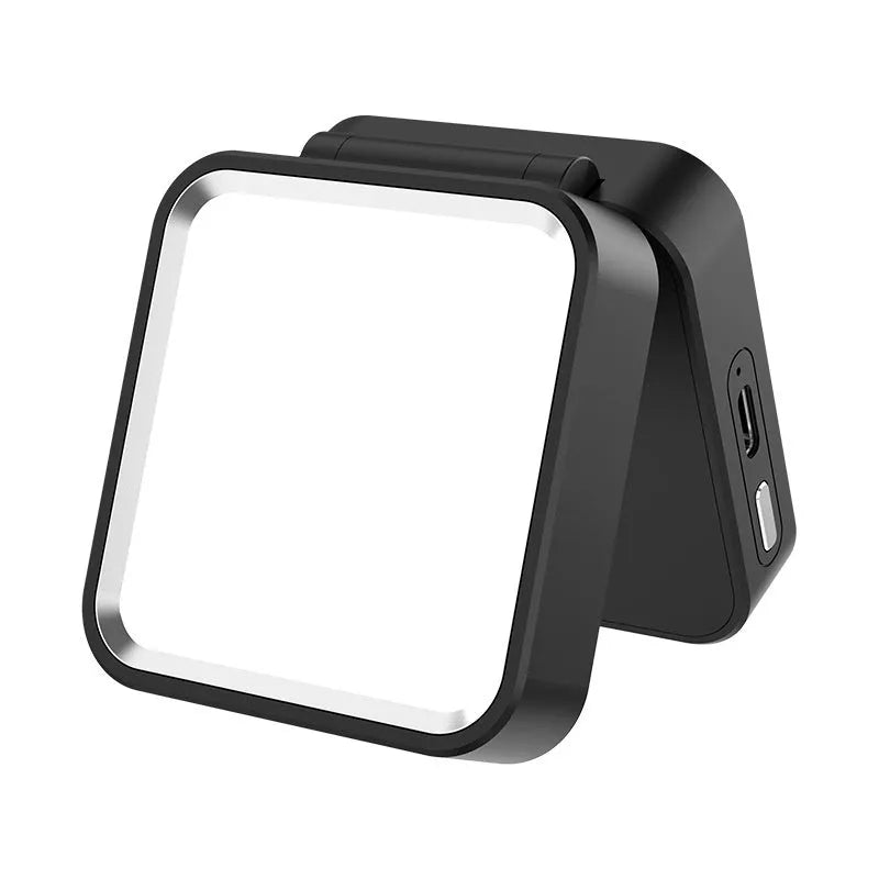 Clip-on LED camping lantern in black, clipped onto a bag, with rechargeable light for night use
