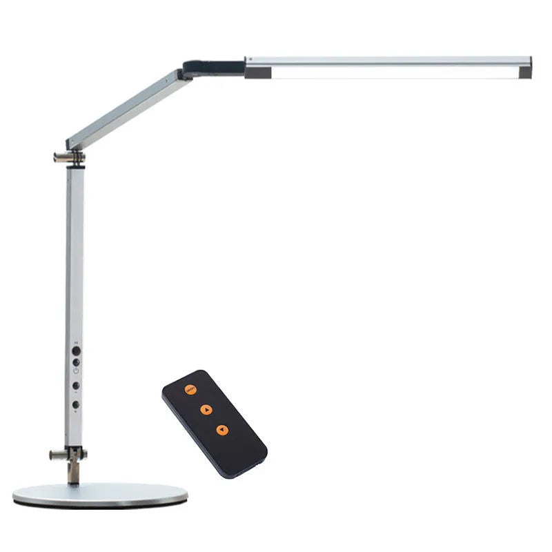 Adjustable LED desk lamp with clip attachment in black finish on wooden desk