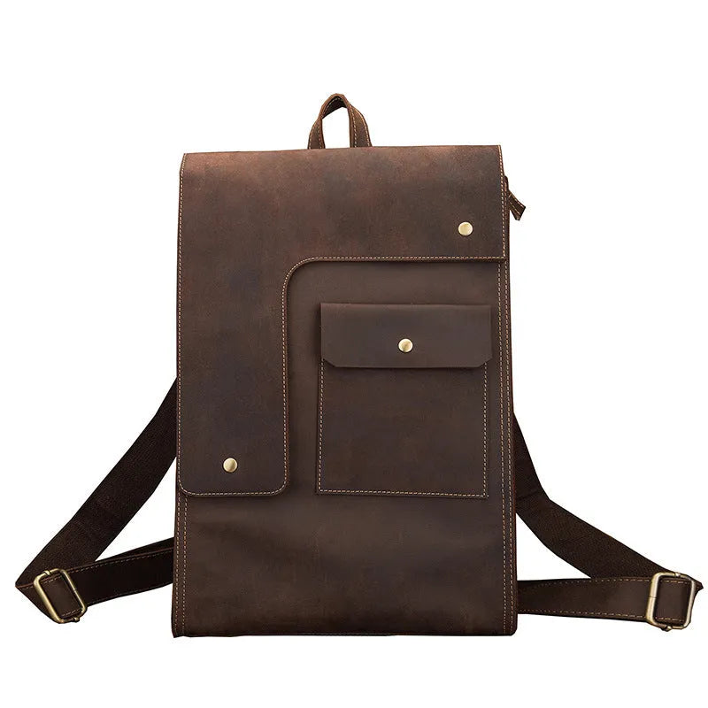 Dark brown genuine leather travel bag with shoulder straps and organised internal compartments