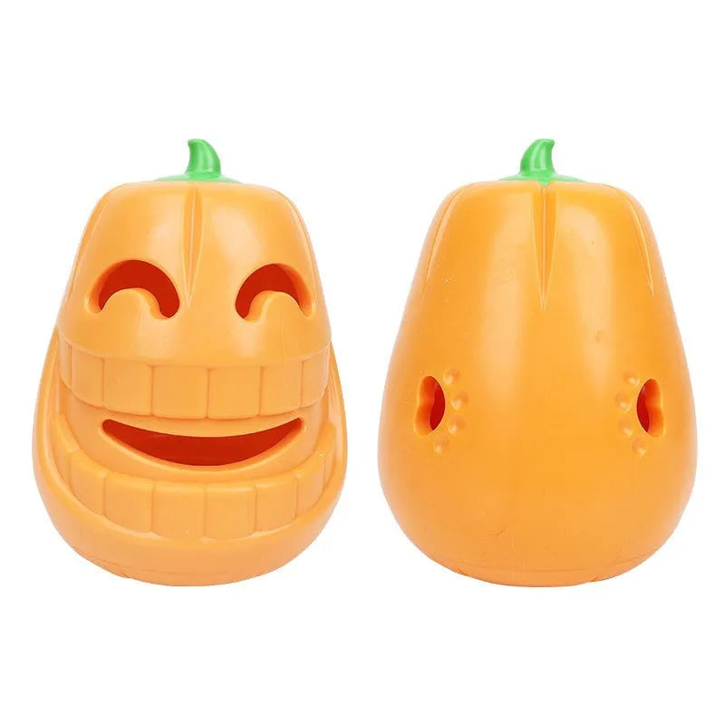 Orange Halloween pumpkin shaped dog chew toy with treat dispensing openings