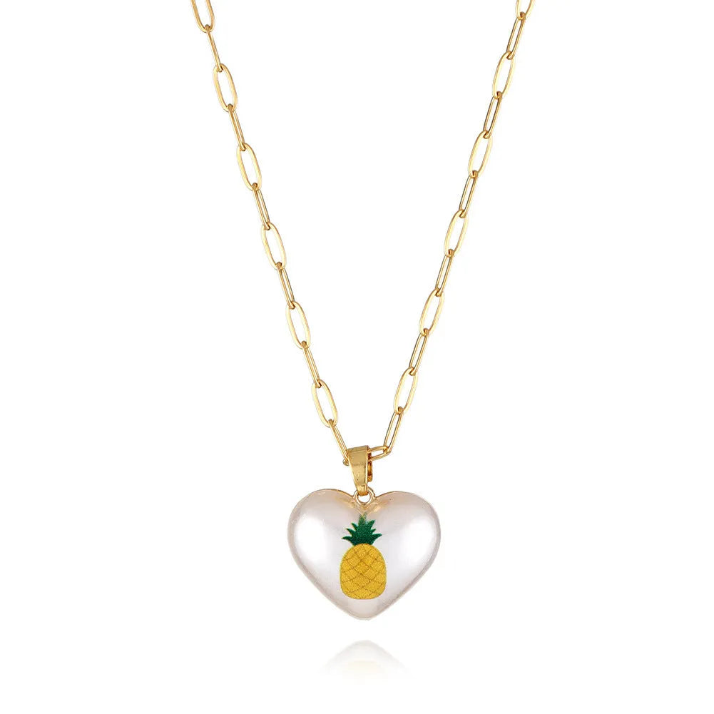 Heart-shaped necklace with fruit pendant on geometric chain showing strawberry pineapple apple pear cherry options