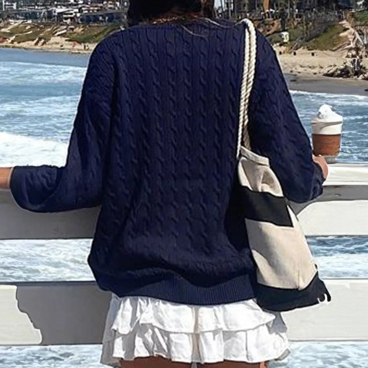 Solid colour long-sleeved viscose knitwear in brown, navy blue, and burgundy on a plain background