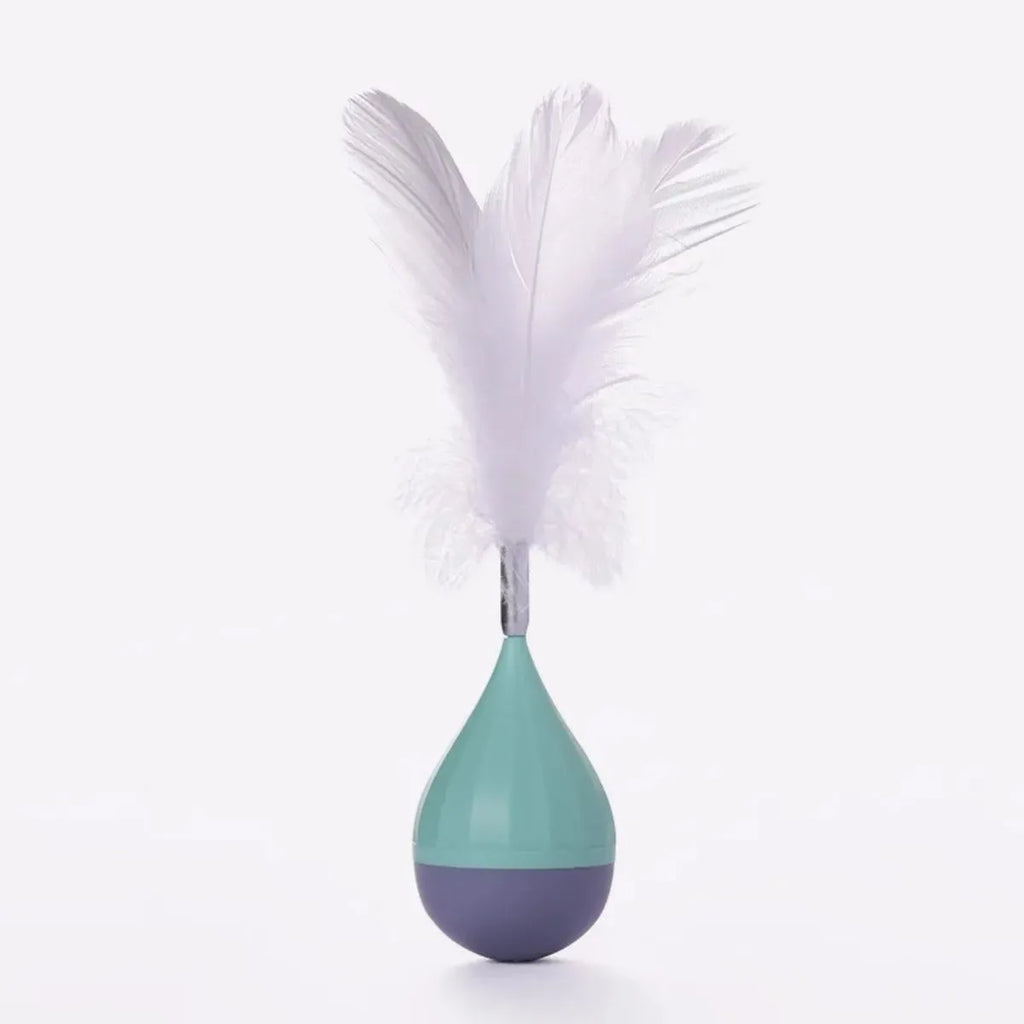 Feather tumbler cat toy with rolling ball and goose feather tease stick on a coloured background.