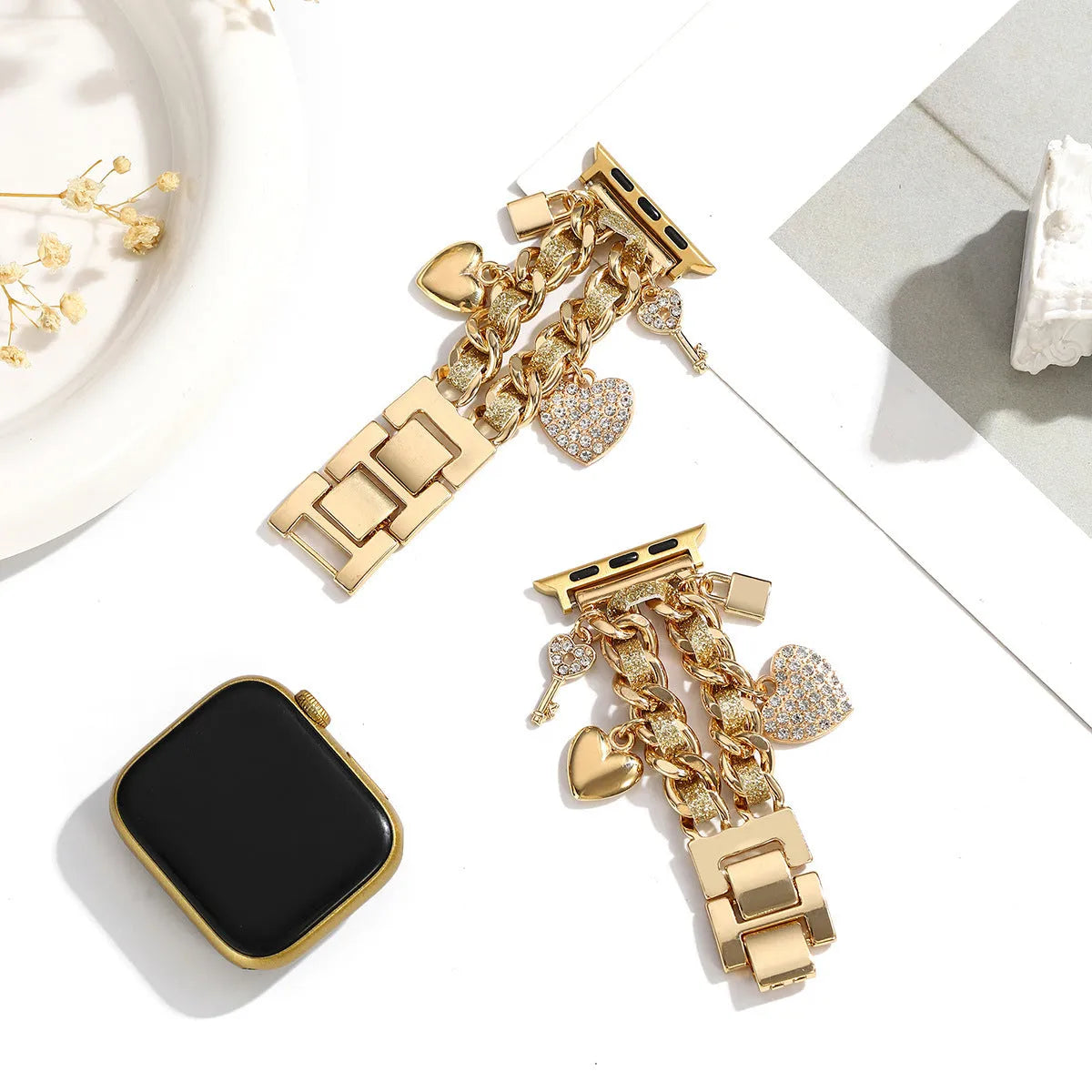 Golden heart pendant ladies watch strap in gold alloy on display with multiple size options visible