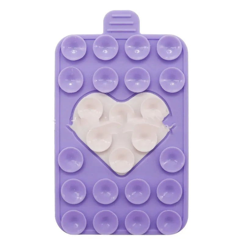 Double sided silicone suction cup phone case holder in gray white, showing hot pressed construction for universal fit on smooth surfaces