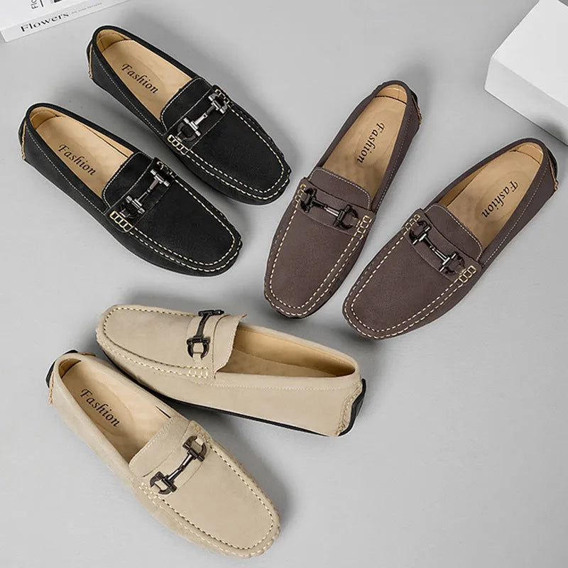 Men's beige cowhide leather slip-on loafers with round toe and rubber sole on a neutral background.