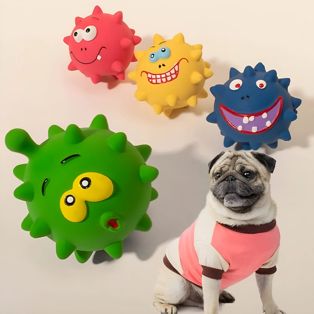 Set of four coloured squeaky dog balls with cute faces, made from natural latex rubber.