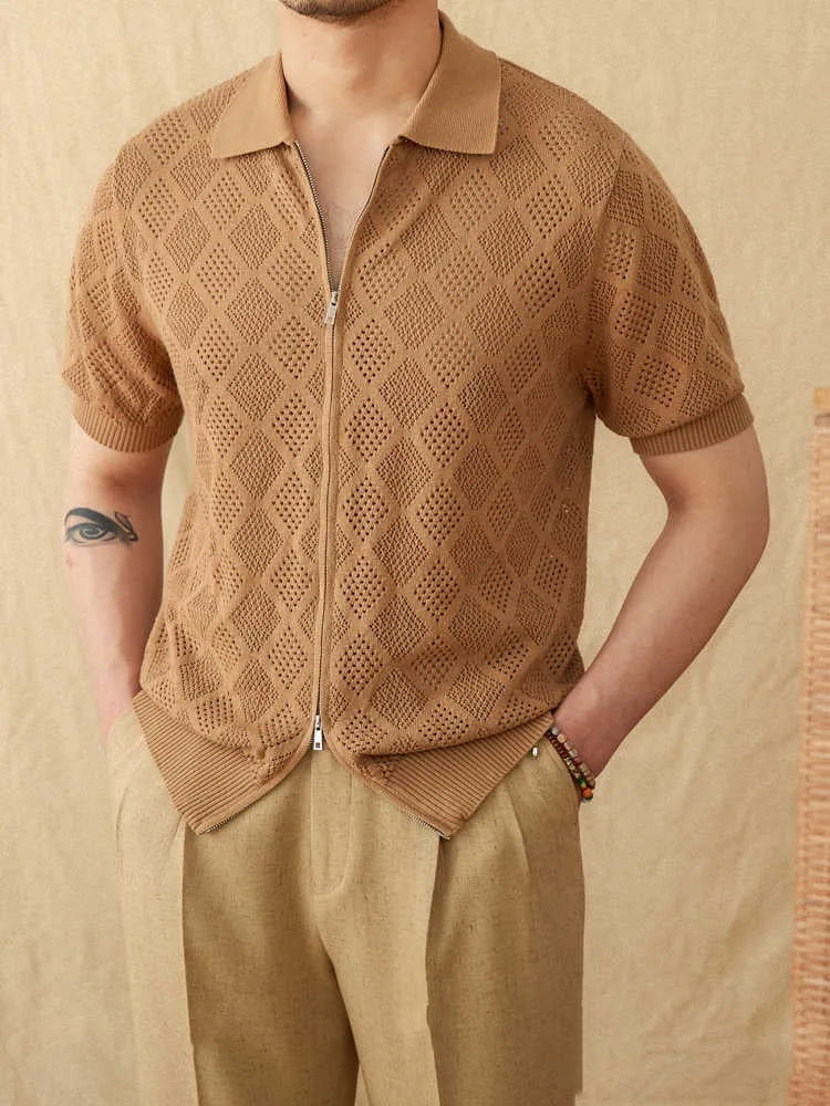 Light brown cotton short sleeve cardigan with a front zipper and lapel collar on a hanger.