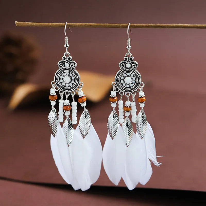 Handmade feather pattern bohemian earrings in multiple colours with leaf design detail
