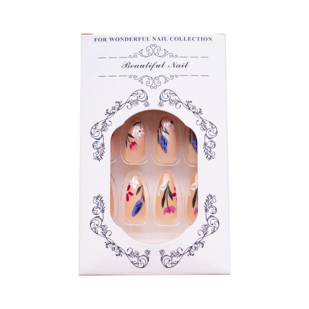 Almond-shaped removable nail art set featuring rose, tulip, and flower patterns on a hand.