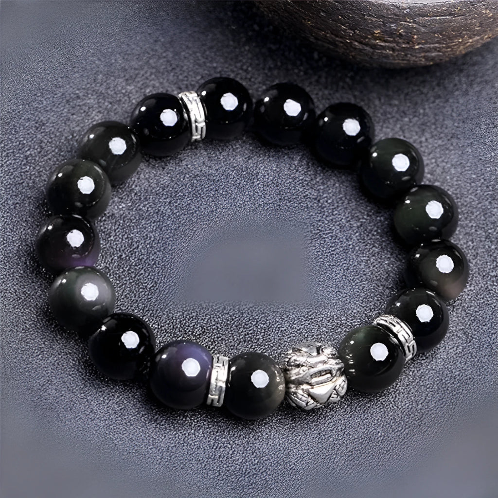 Obsidian bracelet with silver 999 settings showing natural cloud patterns in the beads