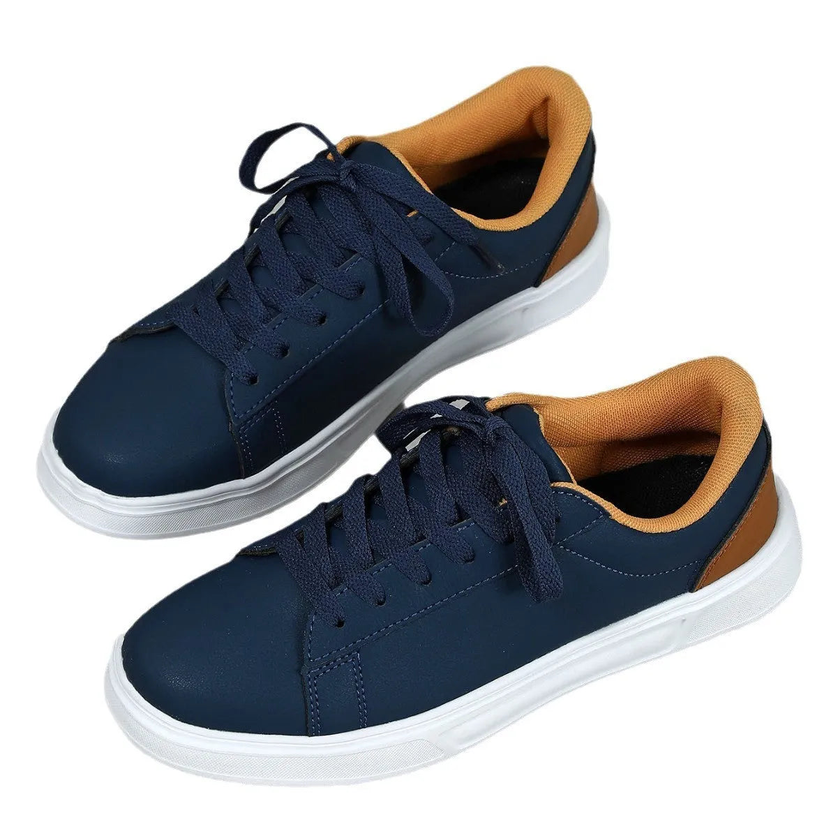 Platform skateboard casual sneaker in beige brown with low top, round toe, and a cross strap detail.