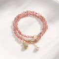 Geometric strawberry quartz crystal bracelet for women on a white background.