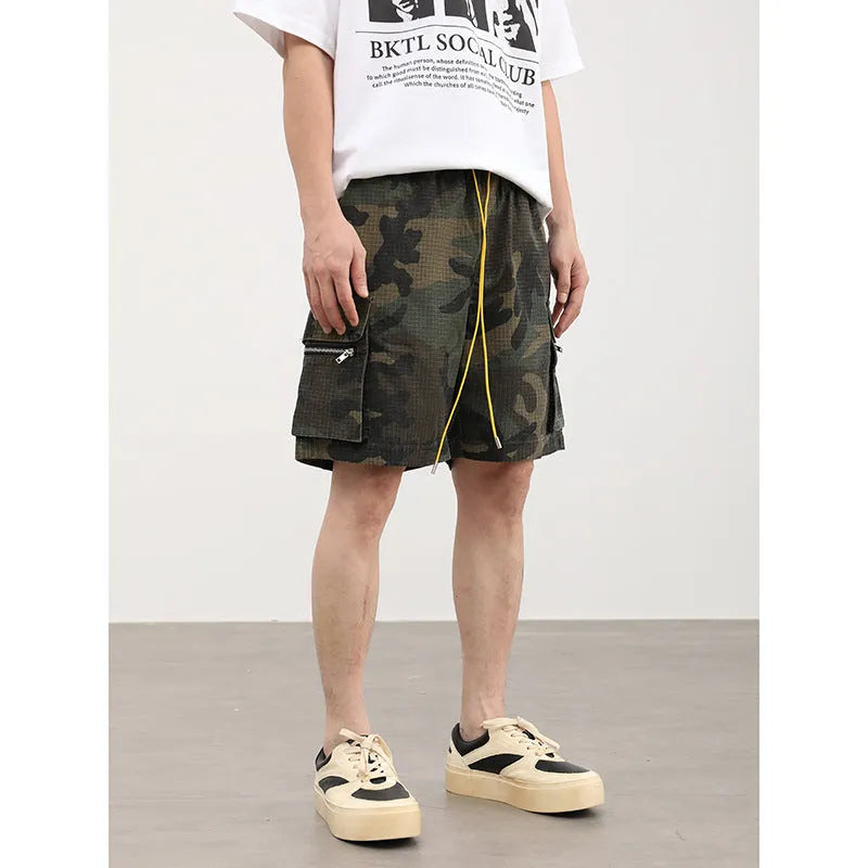 Men's camouflage work shorts with multiple pockets, cropped length and mid waist design