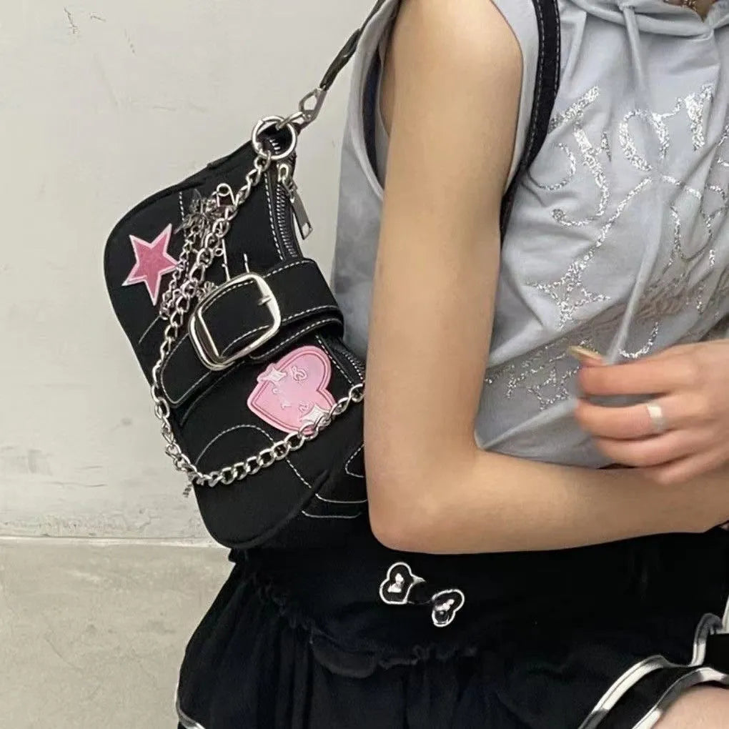 Black PU leather Y2K shoulder bag with heart butterfly shape, bow, stitching, chain, and zipper buckle