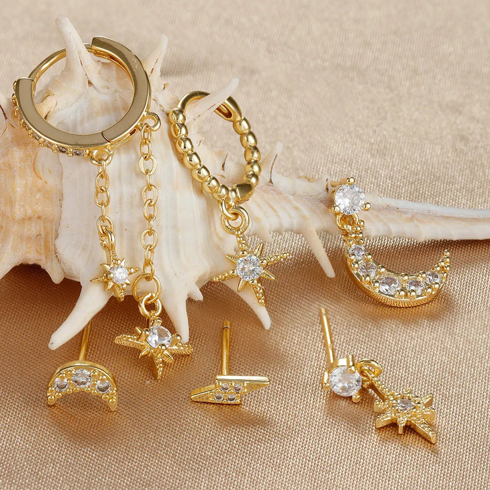 XINGX six-pair gold chain tassel earrings set with zircon studs on jewellery display