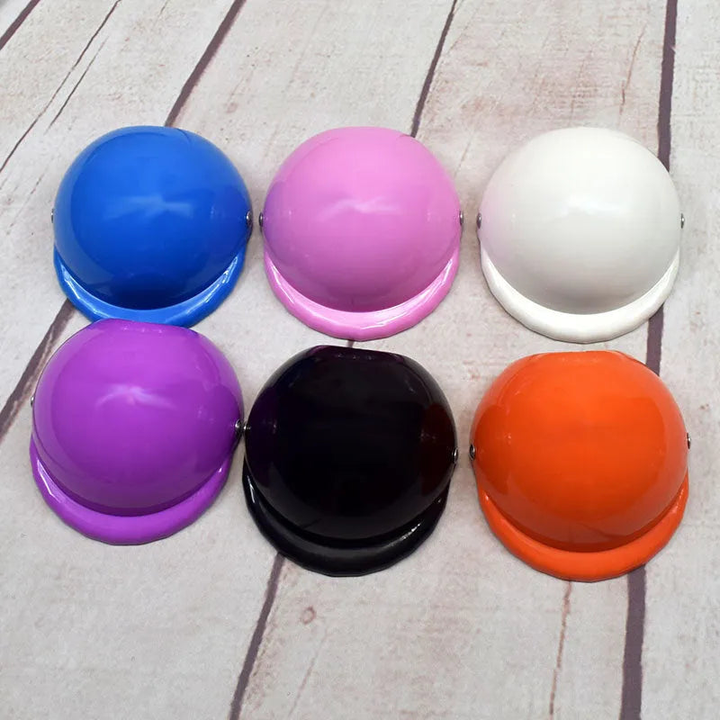 Plastic dog motorcycle cap helmet in a solid colour, shown in small, medium, and large sizes.