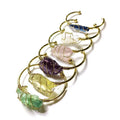 Unisex geometric bracelet made from rough natural crystals with gold metal winding.