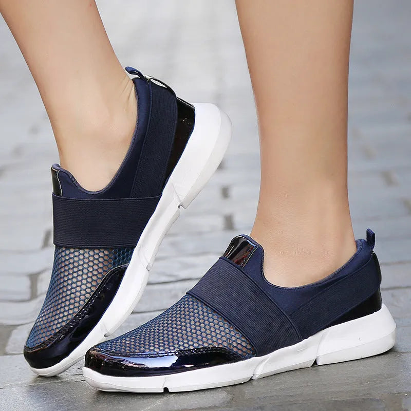 Blue, black, and grey women's lightweight sneakers with mesh lining and low-tube design.