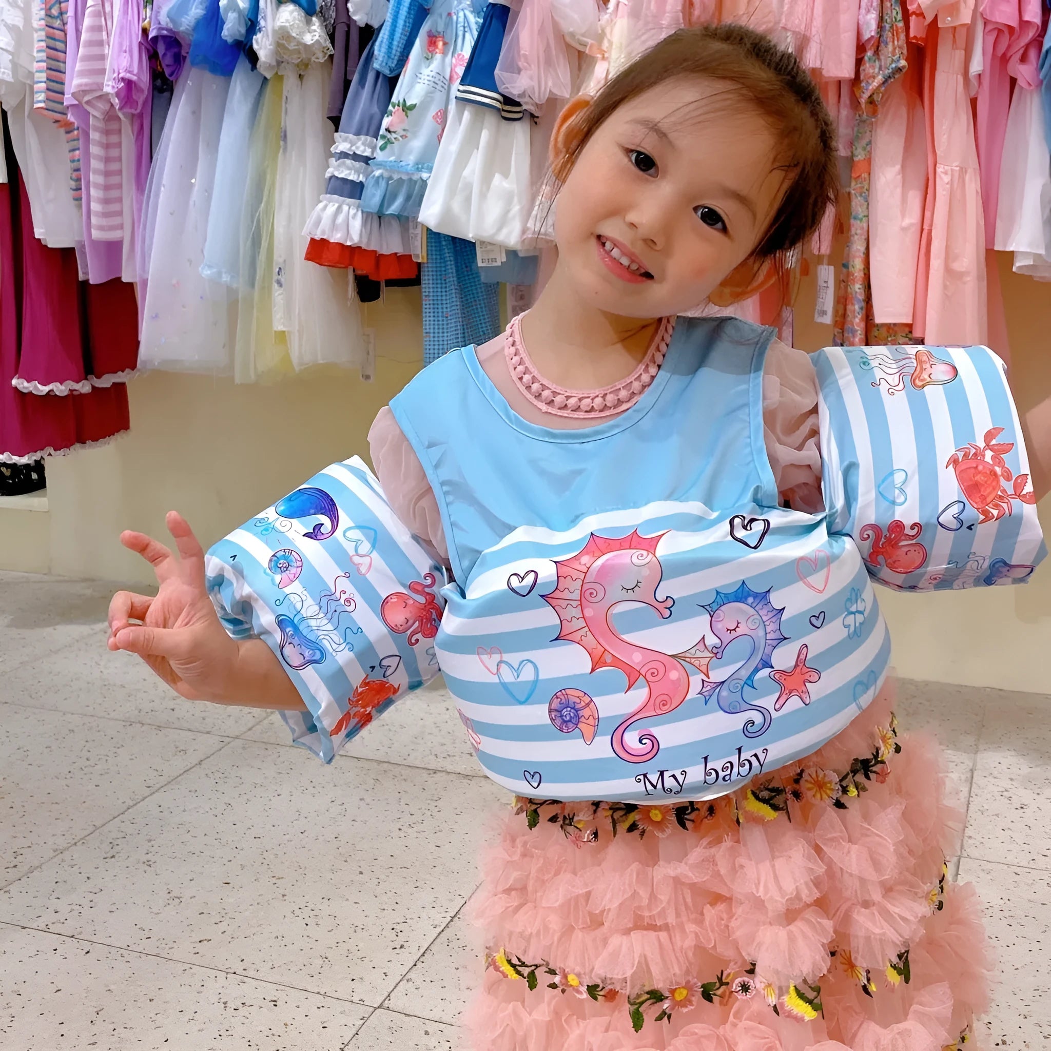 Cartoon design children's swimming arm bands in various colourful patterns including watermelon pineapple and blue crab
