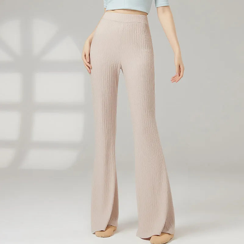 Adult female classical dance practice trousers in beige apricot, shown flat.
