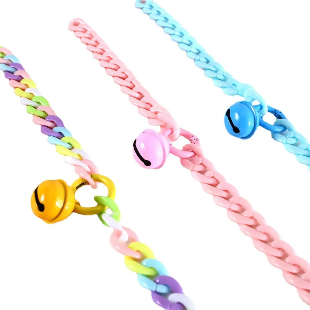 Adjustable plastic pet collar in macaron candy colours with chain detailing, shown with a buckle.