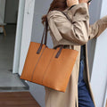 Women's genuine leather commuter bag with internal organisation compartments in horizontal square design
