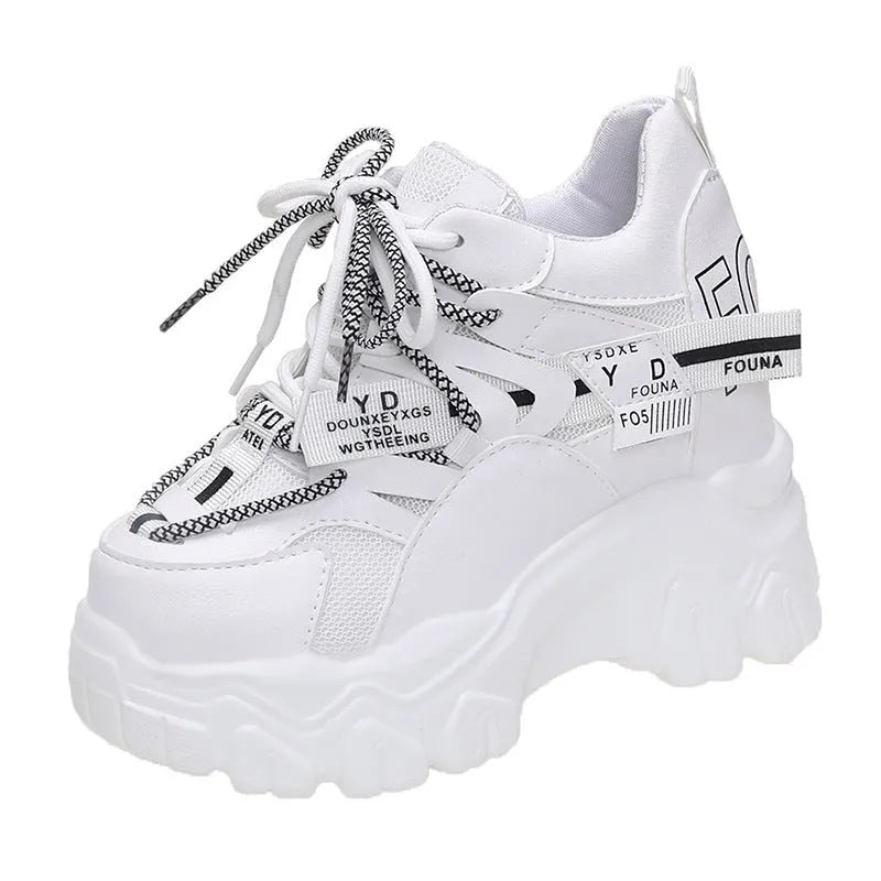 White women's low-top platform sports shoes with a cross-strap and breathable mesh upper on a rubber sole.