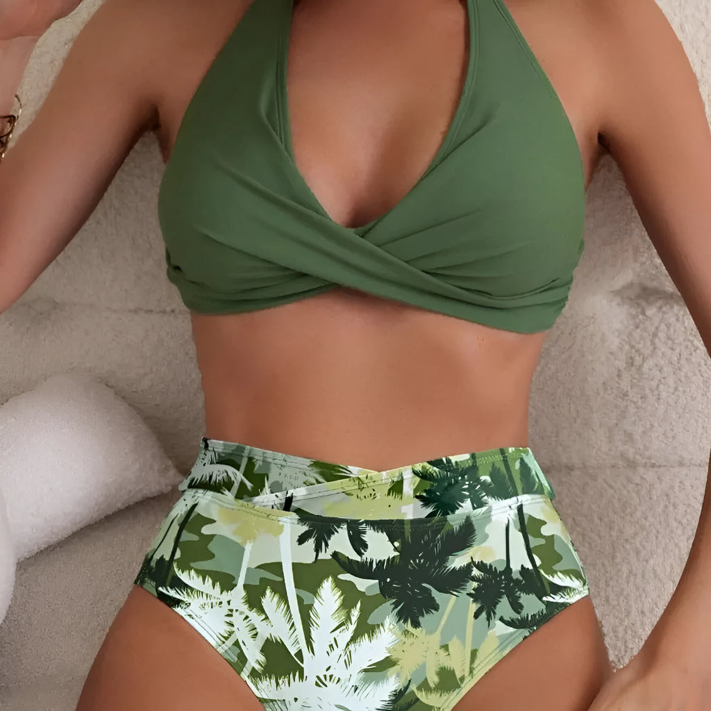 Women's high-waisted floral print swimsuit briefs in peacock green colour.