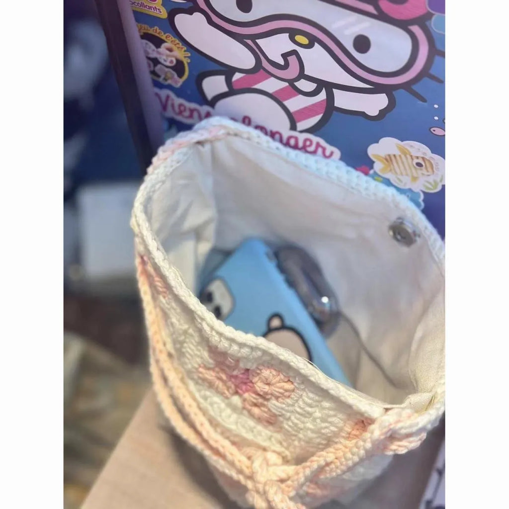 Handmade cotton crochet handbag with cherry blossom design and magnetic buckle closure