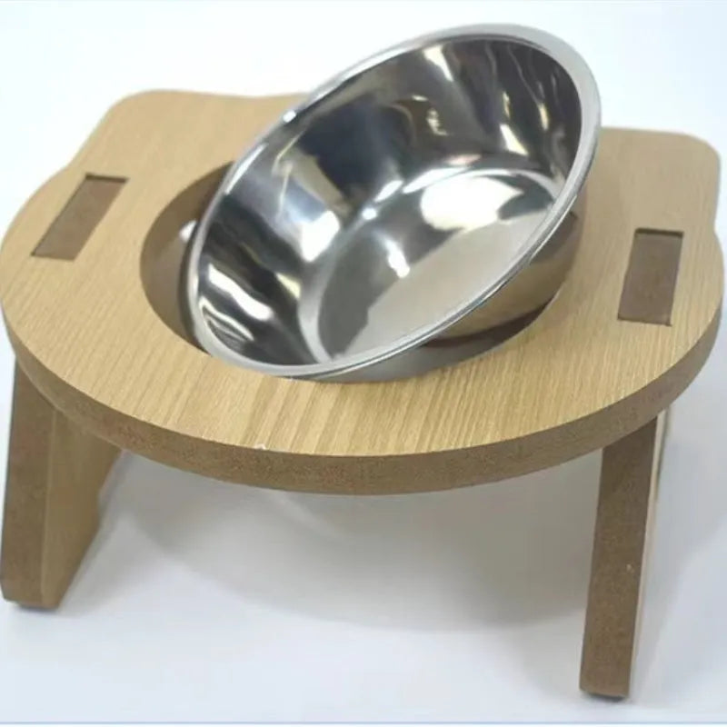 Wooden platform cat feeder holding a stainless steel food bowl and water bowl.