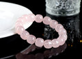 Pink bamboo crystal barrel bead bracelet with 11-12mm beads on a wrist.
