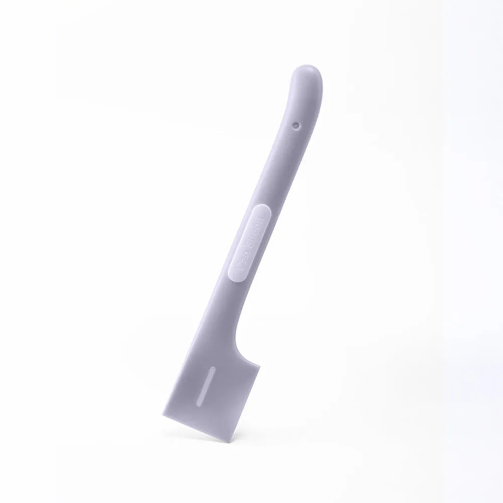 Green long-handled TPR spoon for scooping wet pet food from a tin.