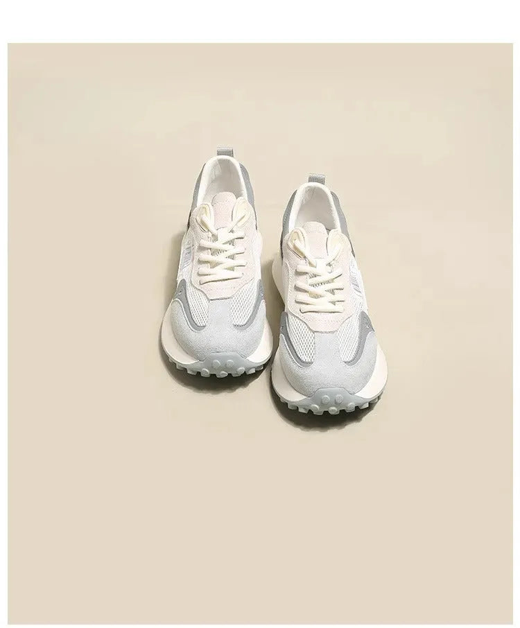 Women's grey and pink retro sneaker with low top design and round toe
