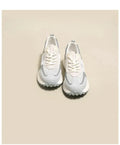 Women's grey and pink retro sneaker with low top design and round toe