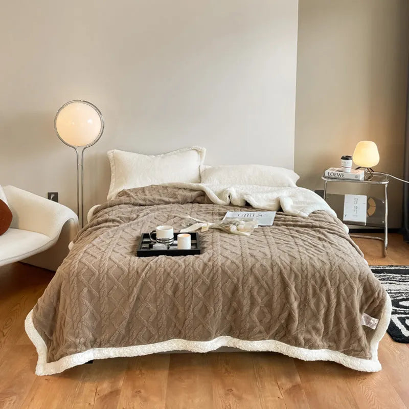 Polyester winter thermal flannel blanket in beige, laid flat showing its texture and simple modern style.