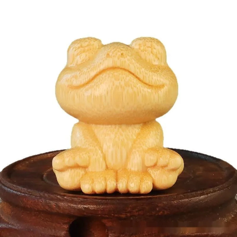 Solid bamboo smiling frog carving ornament measuring 5cm high with cartoon cute style