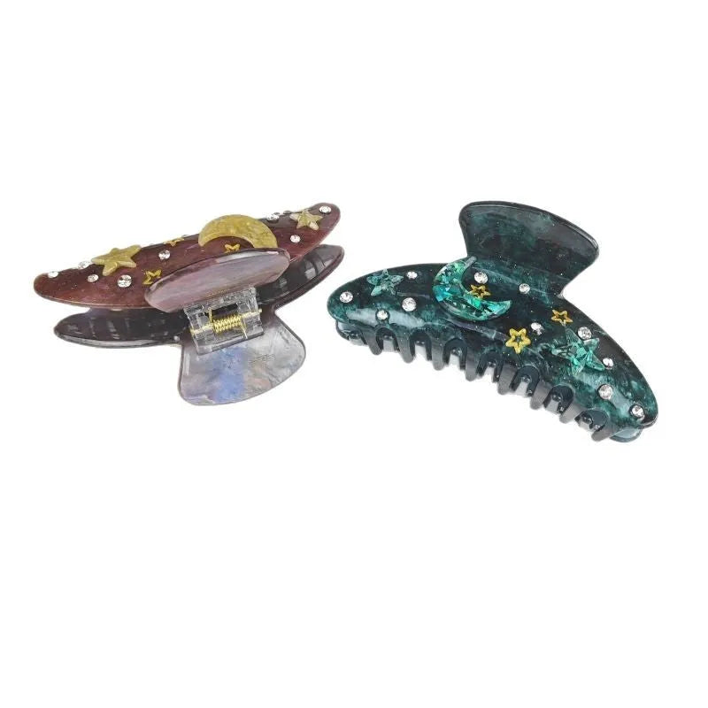 Oversized women's barrette with star moon starry sky design in cellulose acetate sheet material
