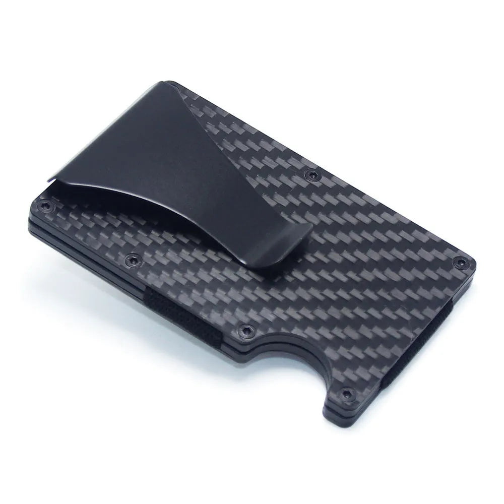 Slim black carbon fibre geometric wallet holding bank cards, showing 8mm thickness profile.