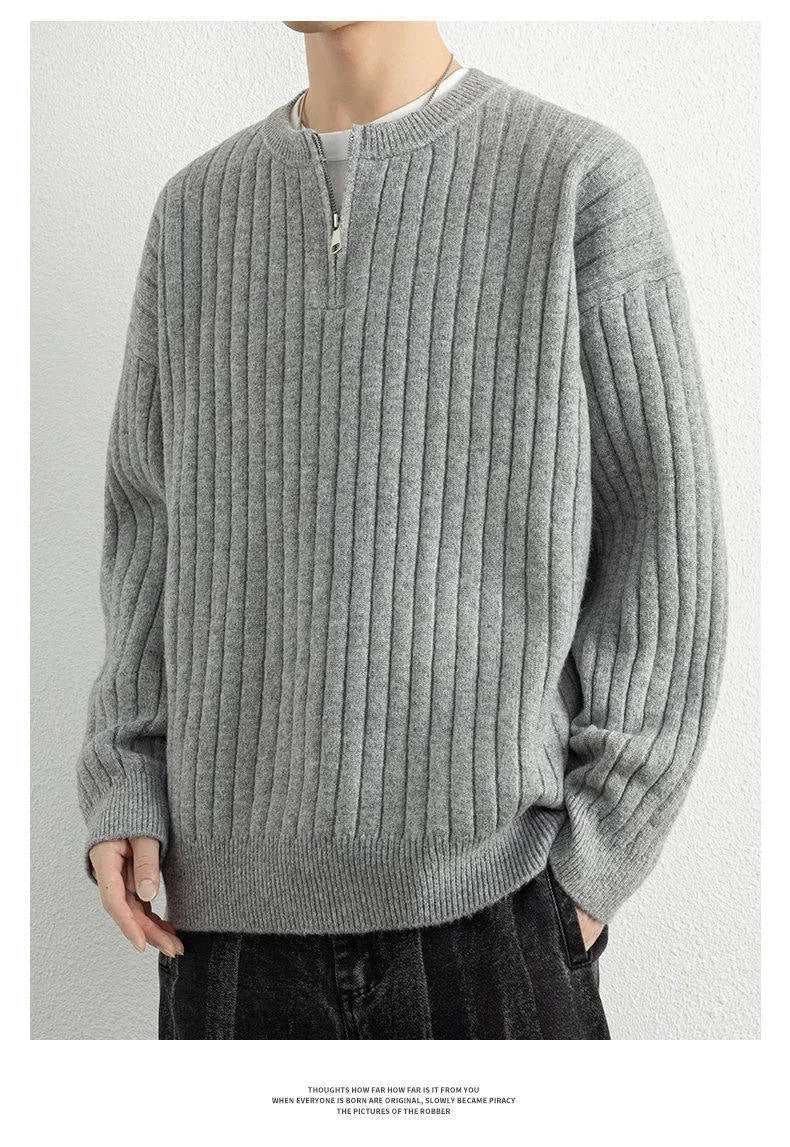 Grey men's loose fit half zip pullover sweater with textured knit and long sleeves.