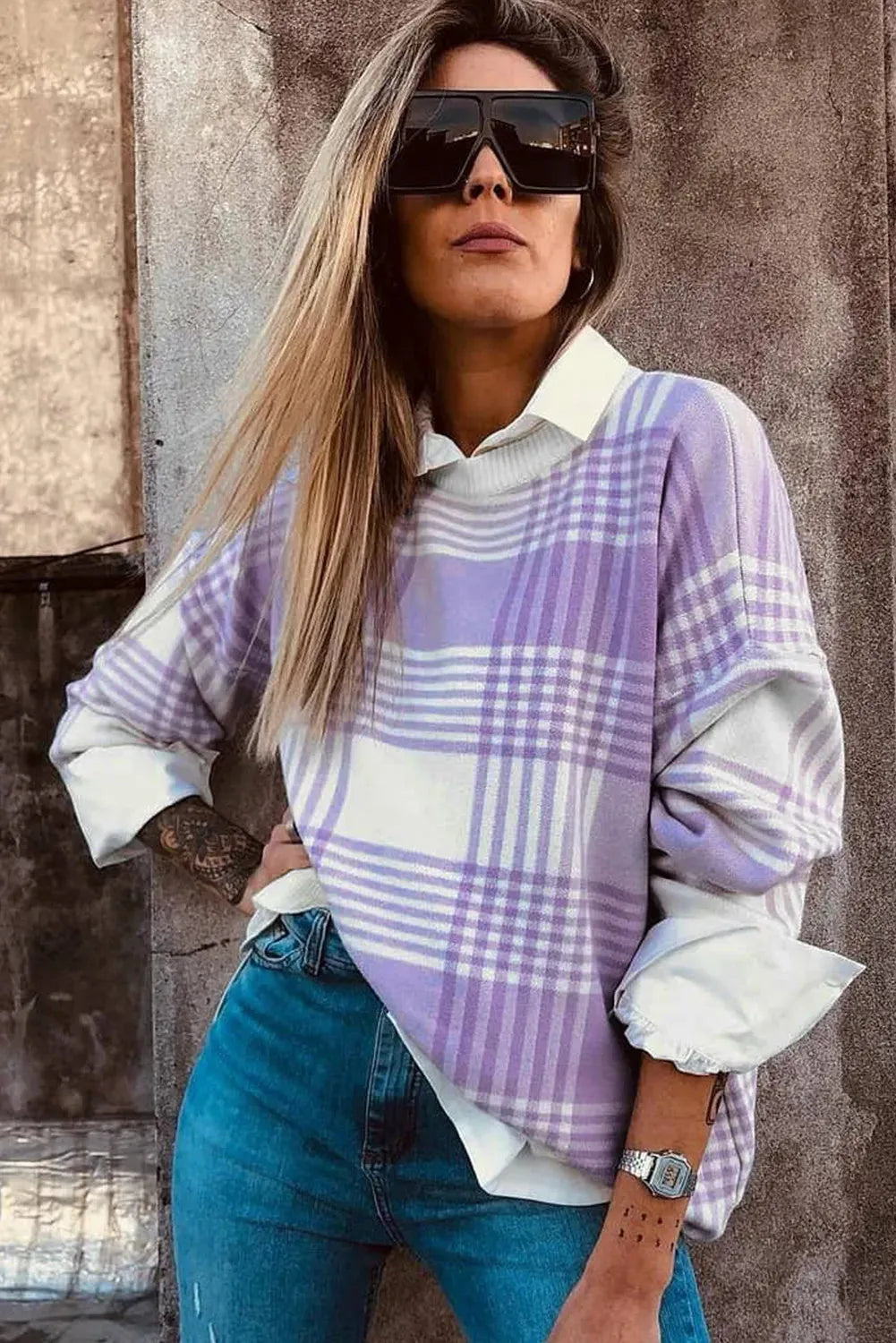 Lilac plaid print loose long-sleeve sweater with ribbed trim on mannequin.