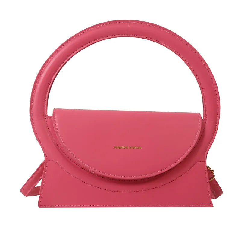 Horizontal square messenger bag in black with stitching detail and shoulder strap
