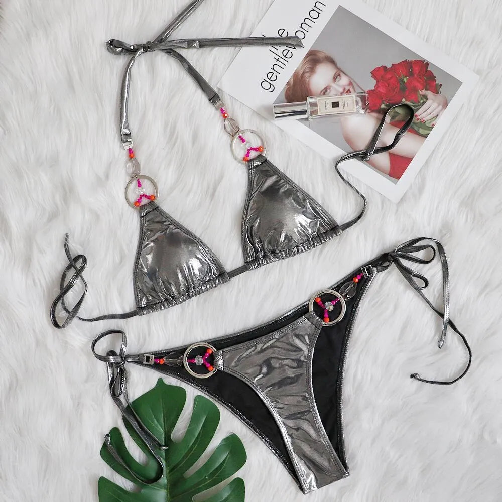 Silver women's bikini swimsuit with briefs bottom on mannequin