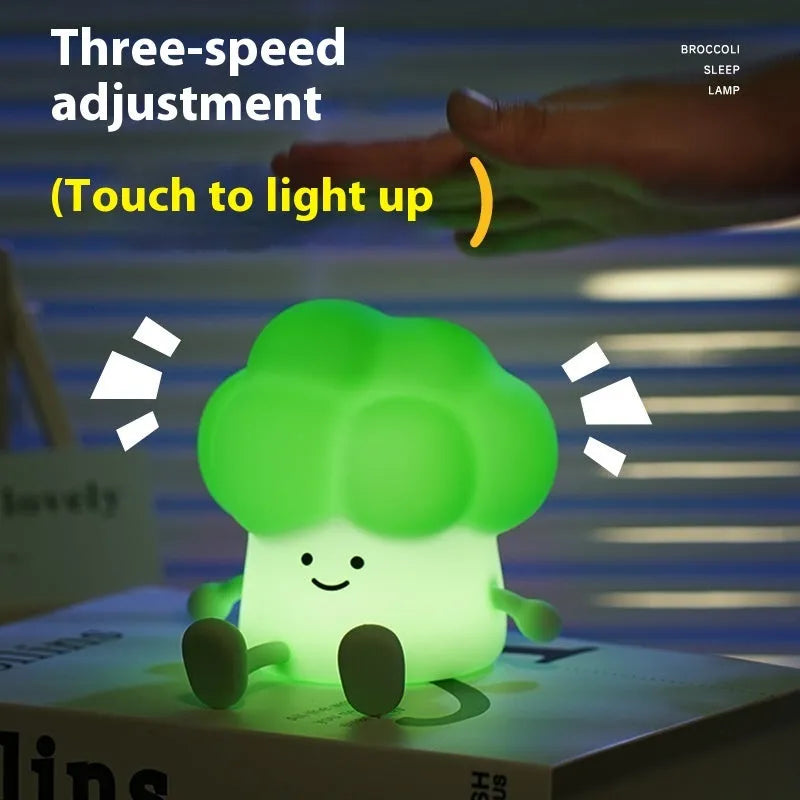 Cartoon eggplant small night lamp with soft yellow light beside broccoli design night light