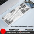 87-key wired mechanical keyboard with two-tone keycaps, shown with switch puller and cleaning brush