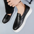 Men's round toe casual shoes in white, black and white, and khaki colours, showing the PU leather upper and oversleeve design.
