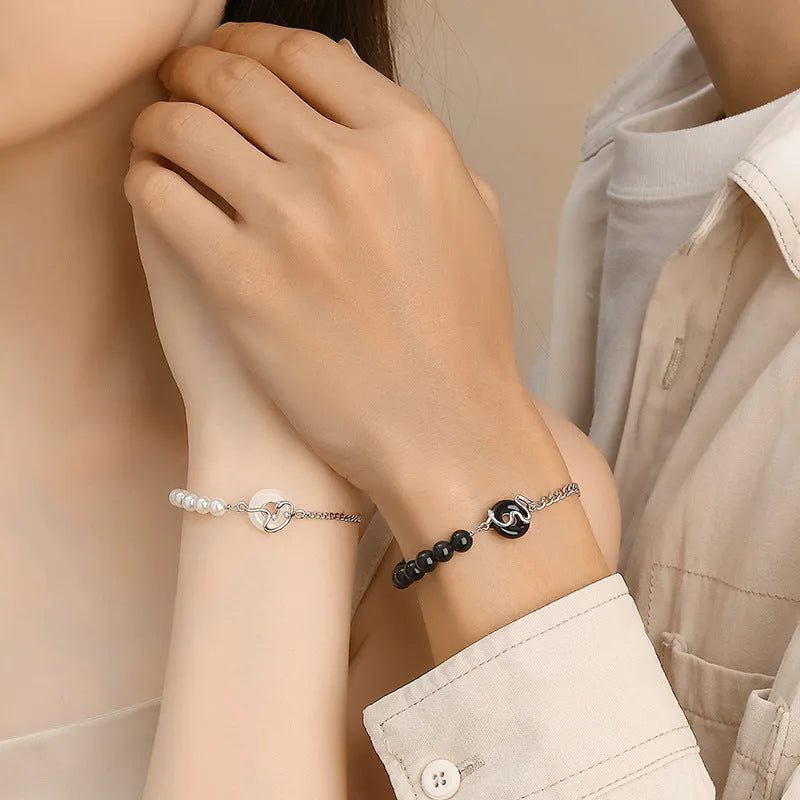 A new Chinese style 925 sterling silver bracelet with an obsidian pearl, snake zodiac charm, and a safe buckle clasp.