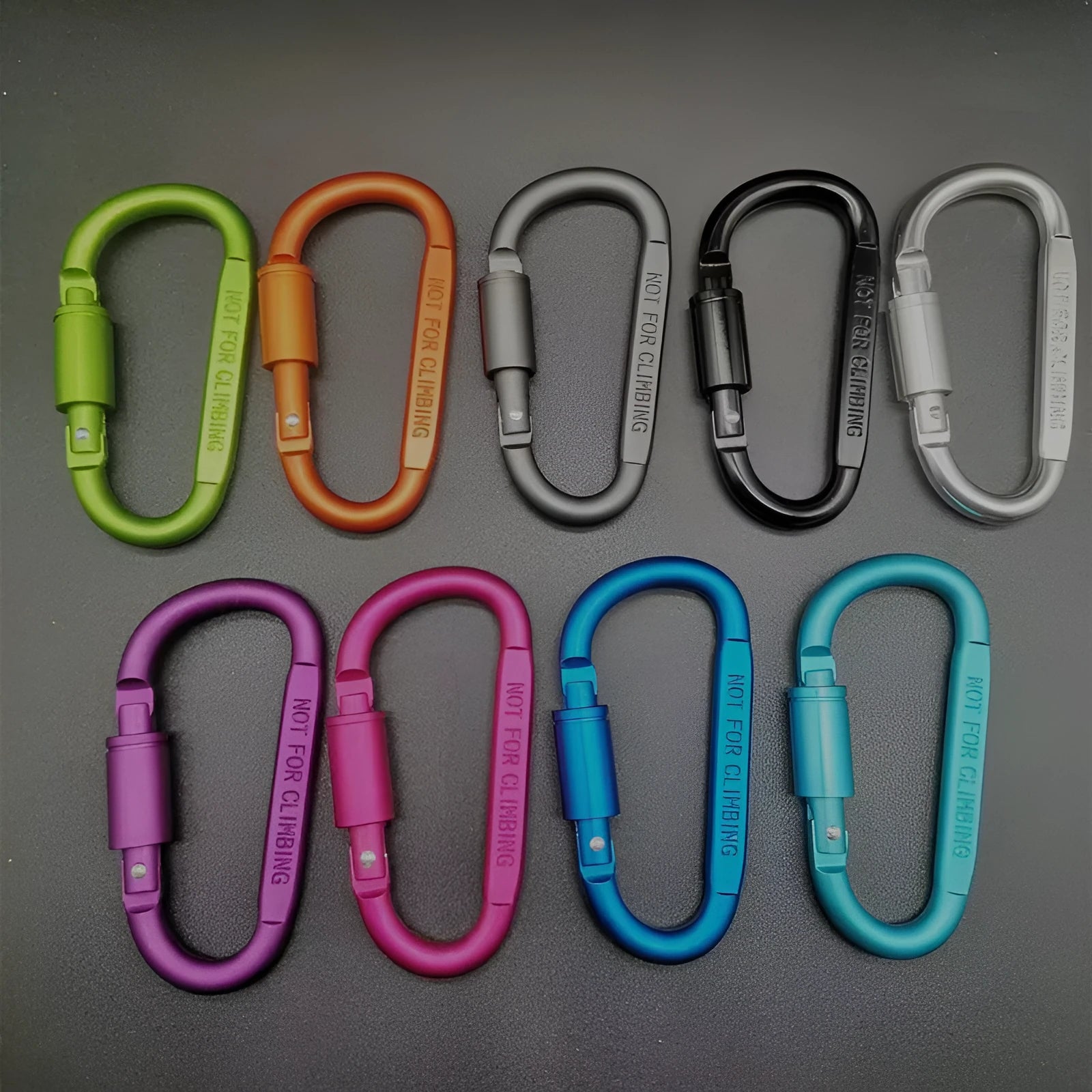Aluminium D-type screw-lock carabiner in red, showing its 8cm size and flat-sided shape.
