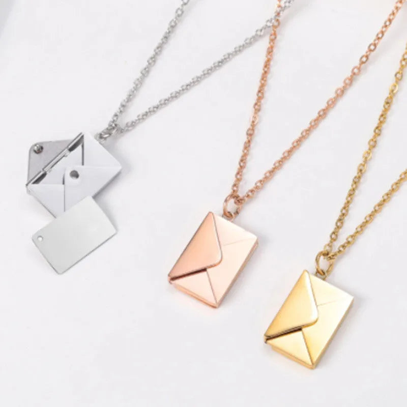 Titanium steel envelope pendant necklace with chain on a woman's neck, gold finish